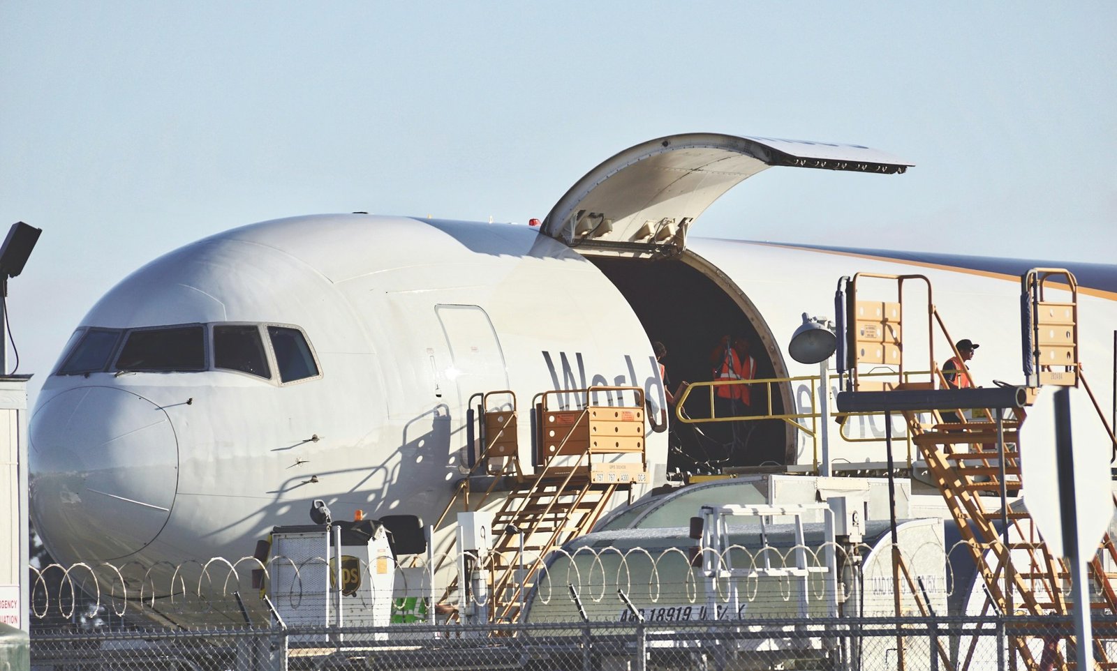 Cargo plane being loaded to deliver packages across the world